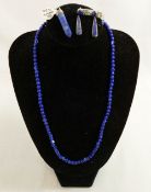 A selection of lapis lazuli jewellery comprised of a beaded necklace, five pendants and a pair of
