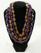 A selection of citrine and amethyst jewellery comprised of four beaded necklaces, four pendants, a