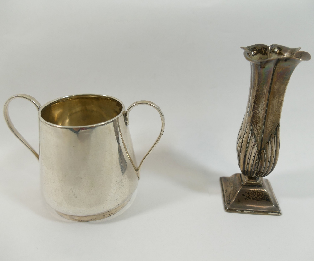 A small late Victorian silver vase, with quatrefoil flared rim, half reeded body and raised on