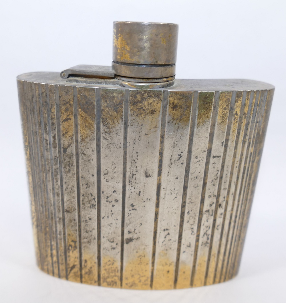 A silver gilt hipflask made for Cartier, London, with graduated banded decoration, London 1973,