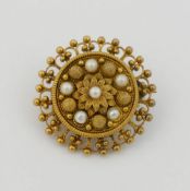 A Victorian circular pearl set brooch, with fine Assyrian style wirework and beading, 2.5cm