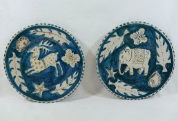 Two Italian Vincenzo Pinto of Vietri blue ground pottery plates, hand painted with an elephant and a