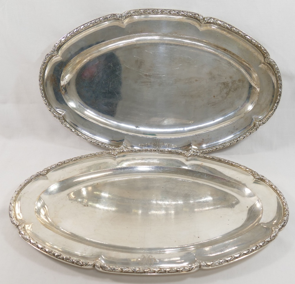 A pair of French silver serving dishes, of oval form, cast with ornate rim, bearing import marks for