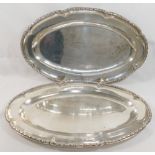 A pair of French silver serving dishes, of oval form, cast with ornate rim, bearing import marks for