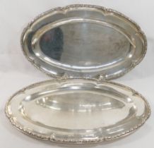 A pair of French silver serving dishes, of oval form, cast with ornate rim, bearing import marks for