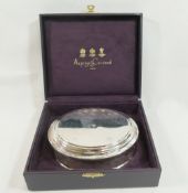 An Asprey and Co. oval silver trinket box, Birmingham 2001, the hallmarked hinged lid with stepped