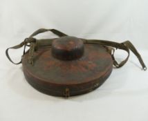 A pair of Buddhist brass cymbals, 30.5cm diameter, with leather handles, housed in red painted