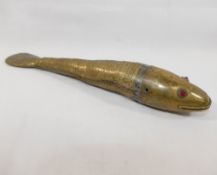 A late 19th/early 20th century Indian brass articulated model of a Koi carp, with red glass eyes,