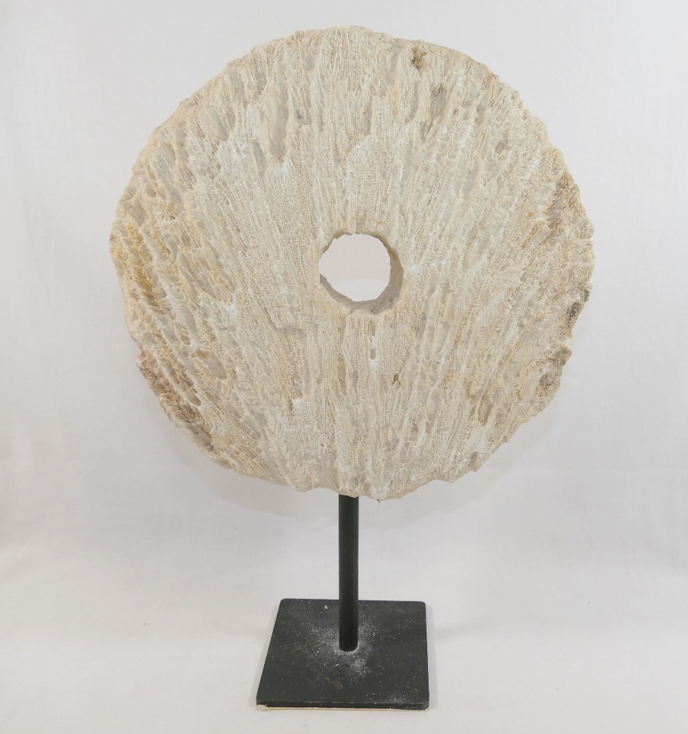 A large coral circular carved disc with central hole, (similar to that of a rai stone), raised on - Image 4 of 4