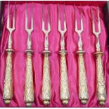 A set of six late 19th/early 20th century German .800 standard silver gilt handled small two-pronged