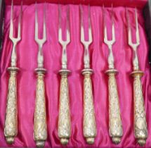 A set of six late 19th/early 20th century German .800 standard silver gilt handled small two-pronged