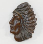 A hand carved wooden wall ornament in the form of the head of a Native American Indian chief, 17.5cm