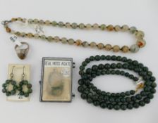 A selection of moss agate jewellery comprised of two beaded necklaces, a pair of drop earrings, a