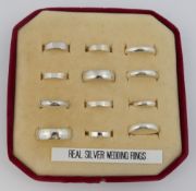 Twelve plain wedding bands, various sizes and styles, and seven Claddagh rings, all hallmarked