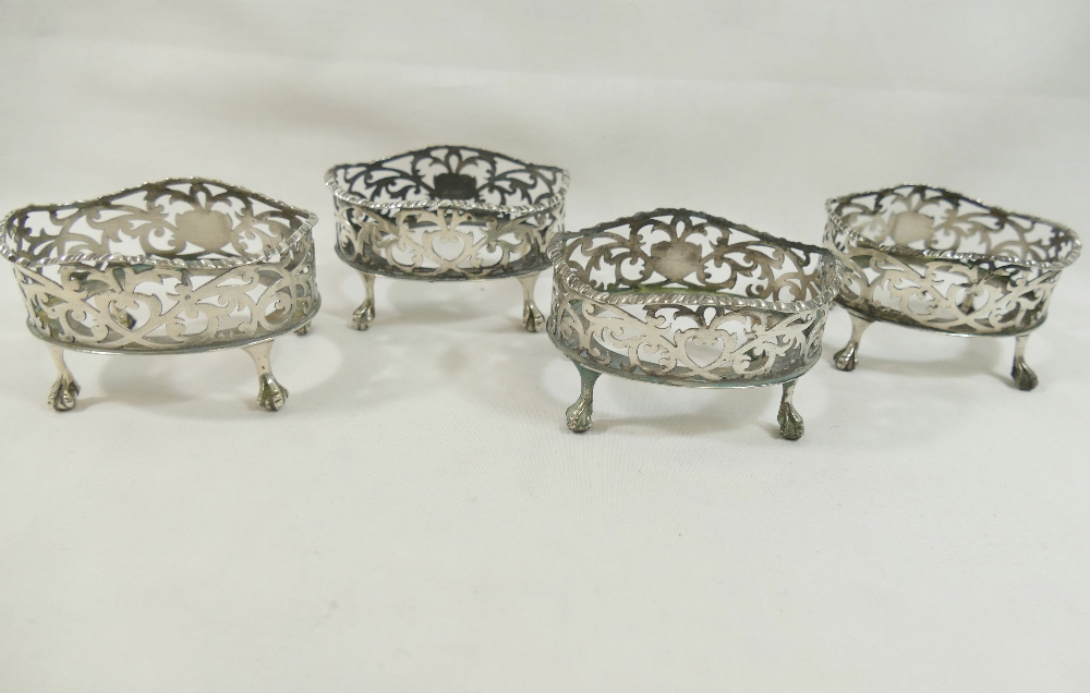 A set of four Edwardian oval pierced salts, raised on claw and ball feet, London 1901 with H E & Co. - Image 3 of 3