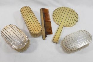 A Jacques Cartier three-piece silver gilt backed hand mirror, brush and comb set, London 1948 with