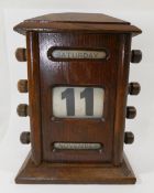 An early 20th century oak desk calendar, 14.5cm high  CONDITION REPORTS & PAYMENT DETAILS