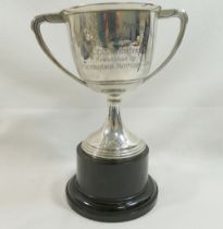 A silver two-handled trophy cup, Birmingham 1956, bearing inscription, 14cm high, 3.13ozt, 97.4g, on