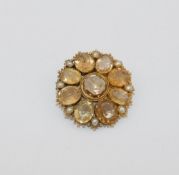 A Victorian gold, topaz and half pearl set circular cluster brooch, with hinged rock crystal