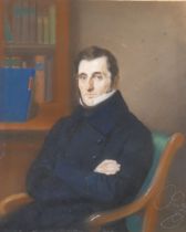 A late 19th century/early 20th century pastel of a seated gentleman, indistinctly signed in pencil