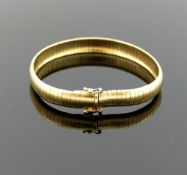 An Italian yellow metal domed omega link bracelet, the clasp stamped '375', 8mm wide, 18.1g gross