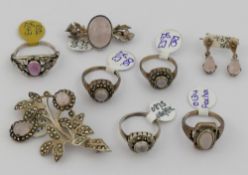 A selection of rose quartz jewellery comprised of five rings, two brooches, two pairs of drop