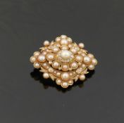 A Victorian gold half pearl and diamond set lozenge-shaped brooch,  set with old-cut and rose-cut