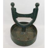 A 19th century Scottish green painted cast iron horseshoe-shaped boot scraper by Carron Co. of