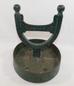 A 19th century Scottish green painted cast iron horseshoe-shaped boot scraper by Carron Co. of