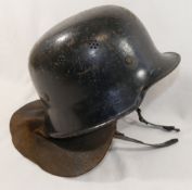 A WWII German 'Feuerwhr' M34 fire protection police helmet, with leather neck protector, the leather