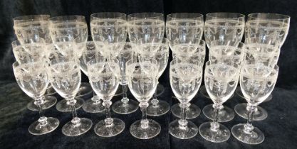 A part suite of Edwardian acid etched glasses comprised of seven champagne bowls, 11.5cm high, seven