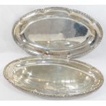 A pair of French silver serving dishes, cast with ornate rim, bearing import marks for London