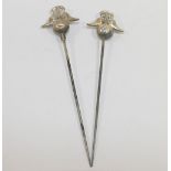 A pair of hollow silver topped hat pins, Birmingham 1911, maker's mark 'P&T', the silver top 2.3cm