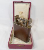 A vintage Cartier leather bound gold plated table lighter, 11cm high, housed in original box