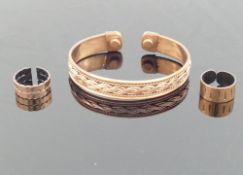 Six hand made copper bangles, and two copper rings, designed to help prevent the wearer from the