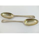 A pair of George III silver fiddle pattern table spoons, London 1778 by John Lamb, with bright cut