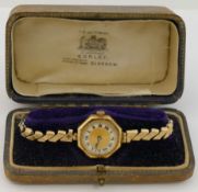 A ladies 18 carat gold cased bracelet watch, the octagonal case 2.1cm wide, with import marks for