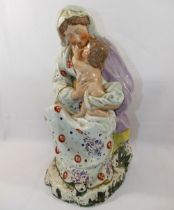 A late 18th/early 19th century Staffordshire pearlware figural group of the Madonna and Child,