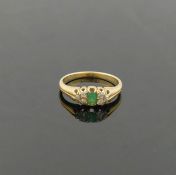 A Victorian emerald and diamond ring, the emerald-cut emerald 4mm x 3mm, flanked on either side by