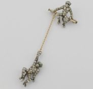 A late 19th/early 20th century Danish paste set gold and silver brooch in the form of two monkeys,