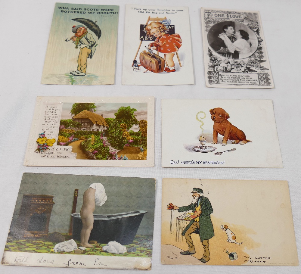 A collection of approximately 40 early 20th century postcards including a set of four humorous