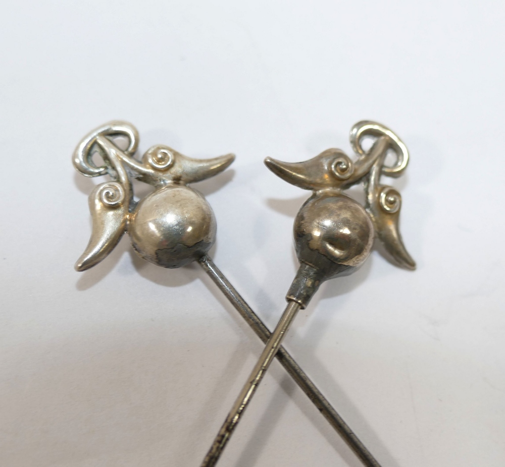 A pair of hollow silver topped hat pins, Birmingham 1911, maker's mark 'P&T', the silver top 2.3cm - Image 2 of 2