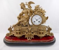 A 19th century French figural gilt spelter cased clock, depicting a young male courtier seated on
