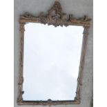 A modern Rococo style gilt-framed wall mirror, the rectangular plate 53.5cm x 74.5cm, the frame 97.