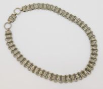 A Victorian/Edwardian silver plated collar necklace, the links decorated with flower heads and