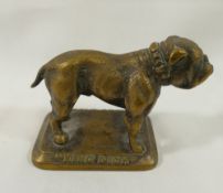 An early 20th century brass mascot of a bulldog entitled 'King Dick', 9cm long, given to buyers of