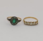 A yellow metal ring set with five clear stones, the shank with indistinct mark,  2.1 gross, a 9