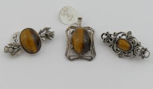 A selection of tiger's eye jewellery comprised of a string of individually knotted cylindrical