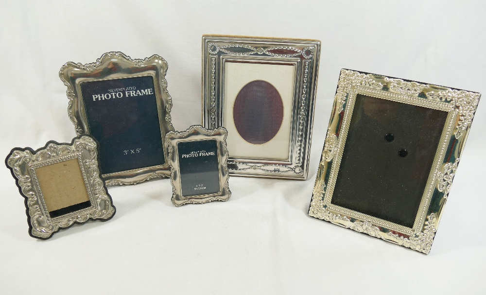 A silver plated photograph frame, with Neo Classical decoration, photo size 12.5cm x 8.5cm, and four