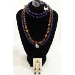 A collection of amethyst and citrine set jewellery, the amethyst jewellery comprised of an